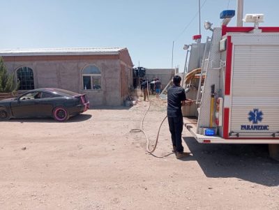Llevan bomberos de NCG agua a la Miguel Angel Escarcega